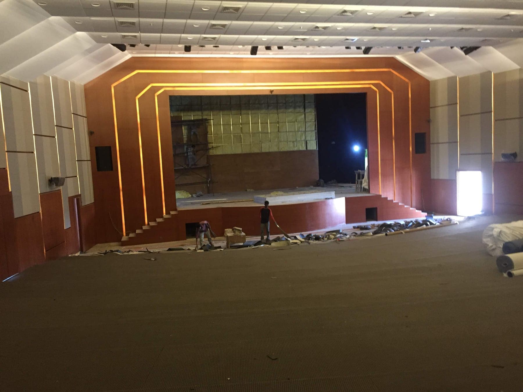 Namsai Multipurpose Cultural Hall proscenium stage with a concentric LED-edged stepped frame, during installation.