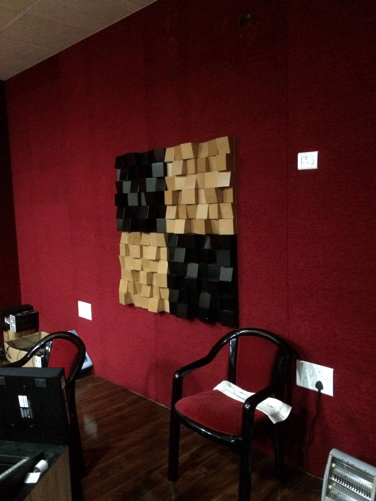 Recording Studio Naharlagun — control room wooden diffuser over fabric-wrapped acoustic wall