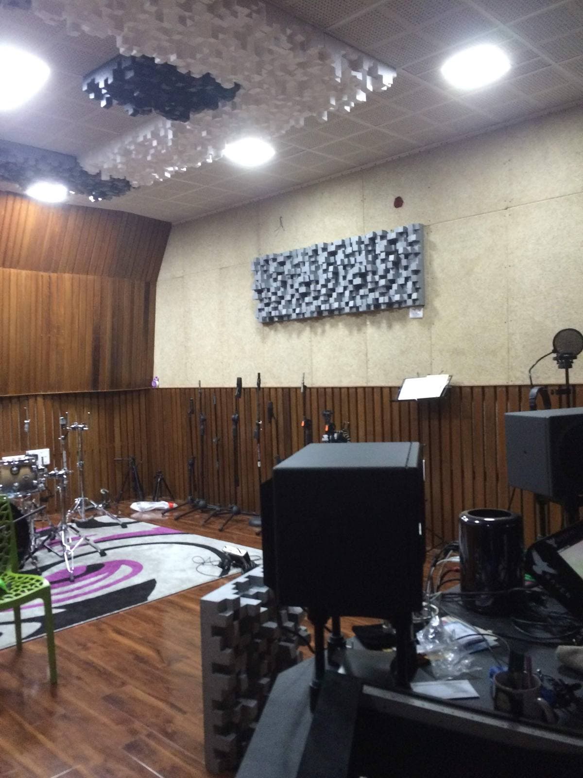 Recording Studio Naharlagun — tracking room wall diffusion with a reference monitor on a stand