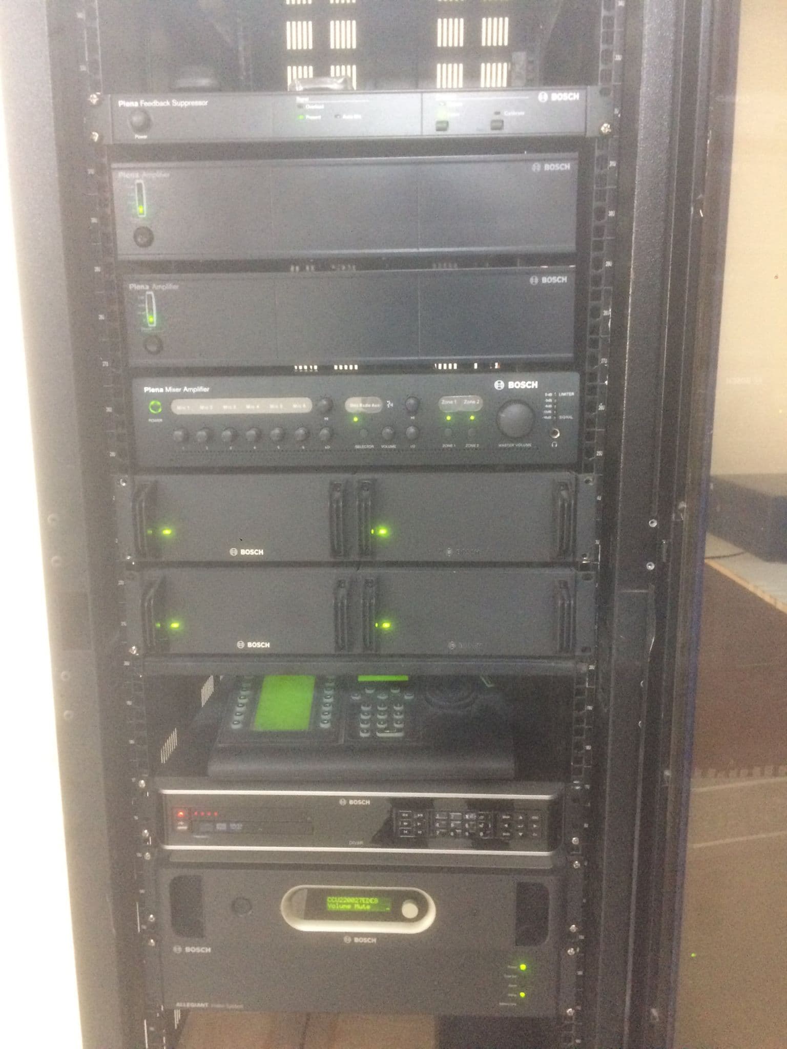 Equipment rack with Bosch Plena mixer, dual booster amplifiers, feedback suppressor, joystick camera controller, DAT recorder and Bosch DCN central control unit