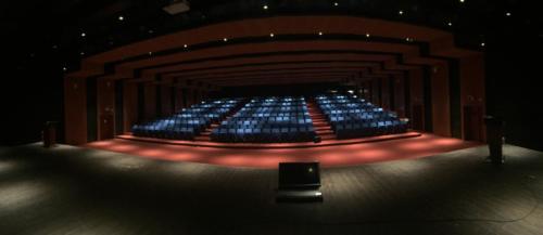 Legislative Assembly auditorium Itanagar — blue theatre seating, proscenium arch